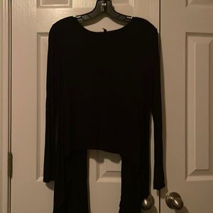 Black long sleeve top that is short in the back